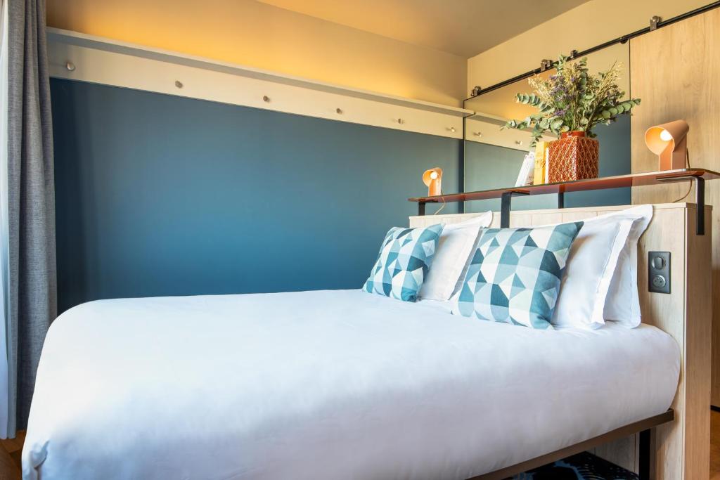 Postel nebo postele na pokoji v ubytování Hotel Kaijoo by HappyCulture