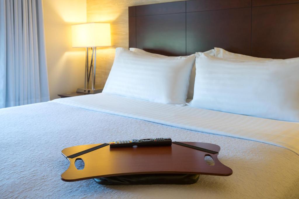 a suitcase sitting on a bed in a hotel room at Holiday Inn Baltimore BWI Airport, an IHG Hotel in Linthicum Heights