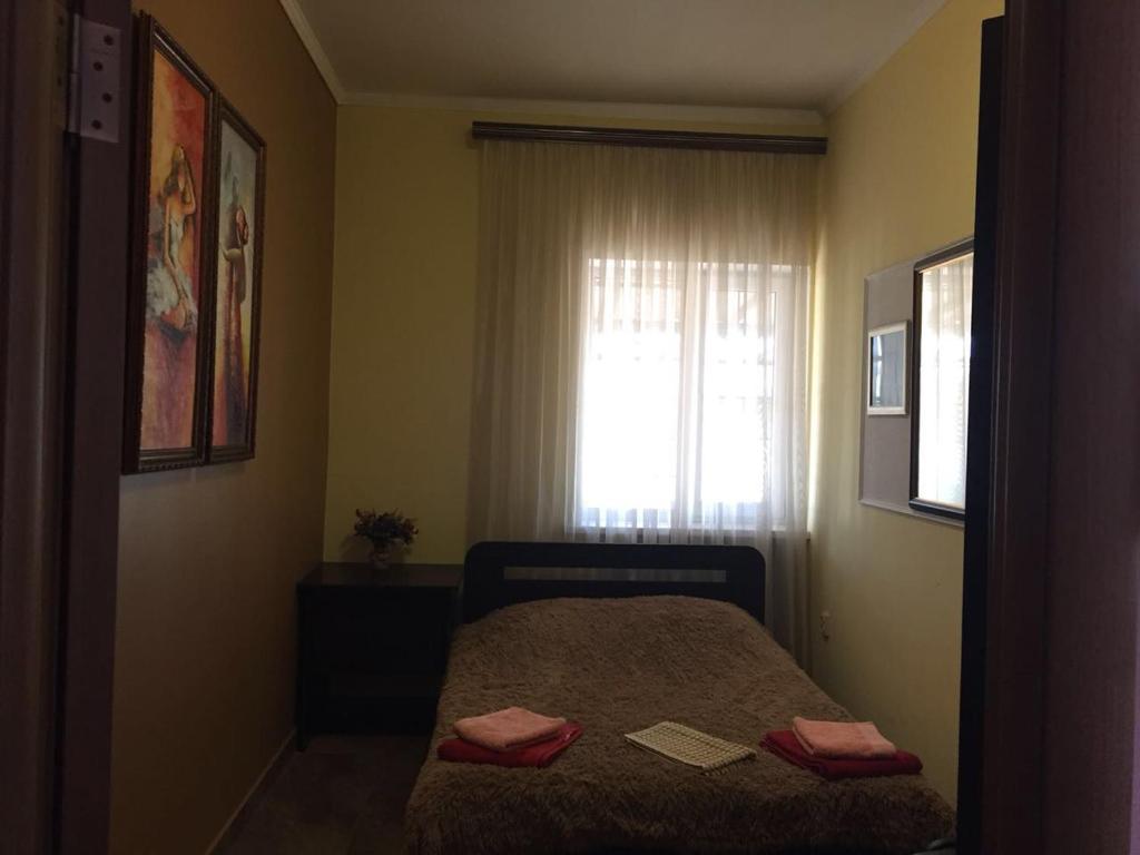 Кровать или кровати в номере Апартаменты в Ессентуках