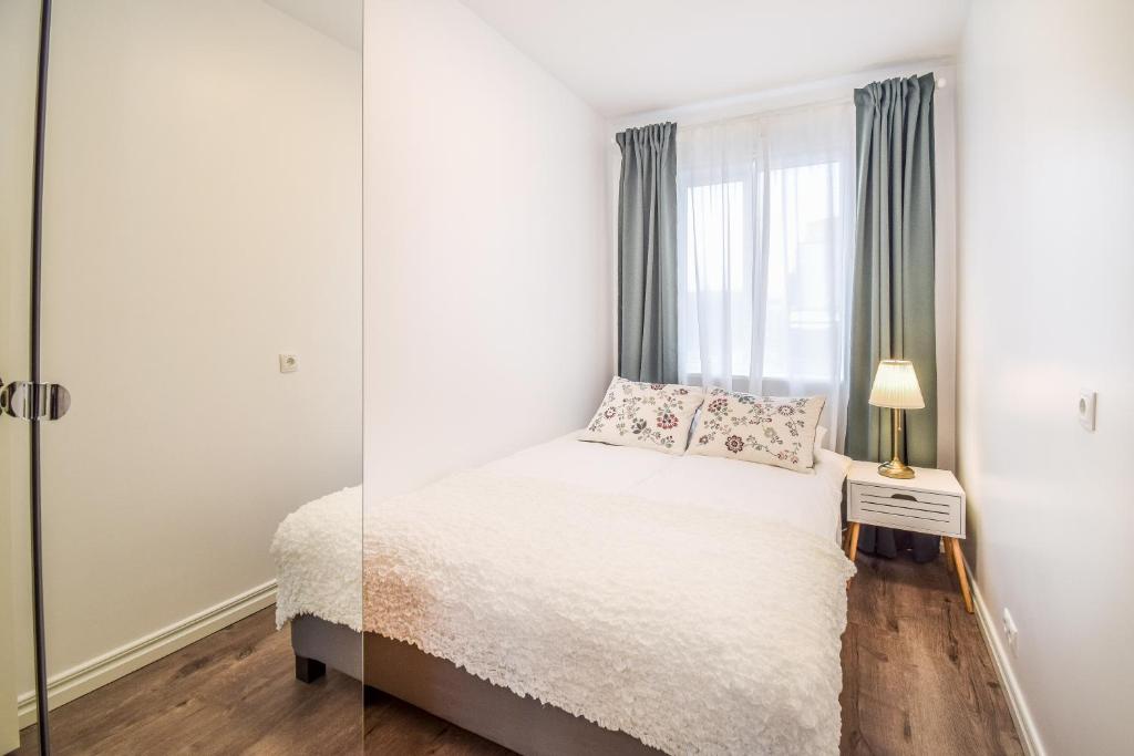 Postel nebo postele na pokoji v ubytování Greenkey Apartment S30