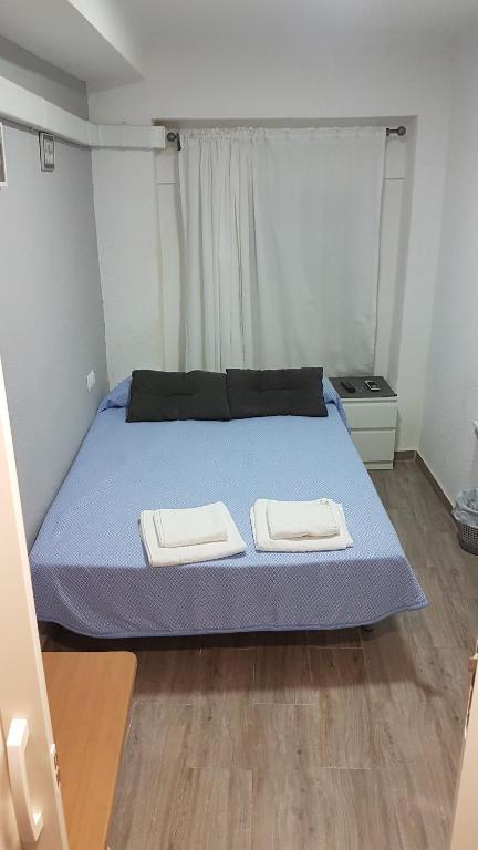 Postel nebo postele na pokoji v ubytování Guesthouse Central