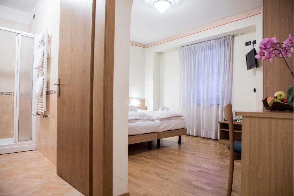 Postel nebo postele na pokoji v ubytování Active Hotel Rosat