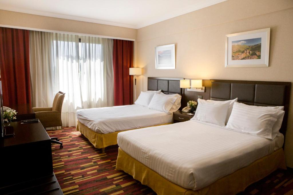 เตียงในห้องที่ Holiday Inn Ezeiza Airport, an IHG Hotel