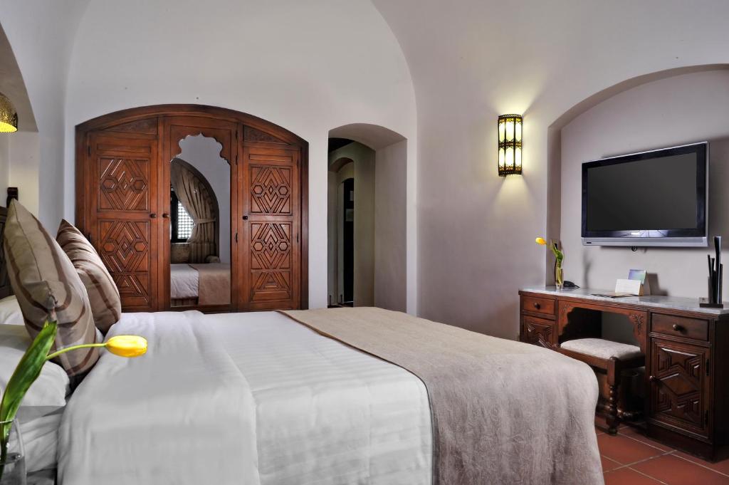 Postel nebo postele na pokoji v ubytování Movenpick Resort Sharm El Sheikh