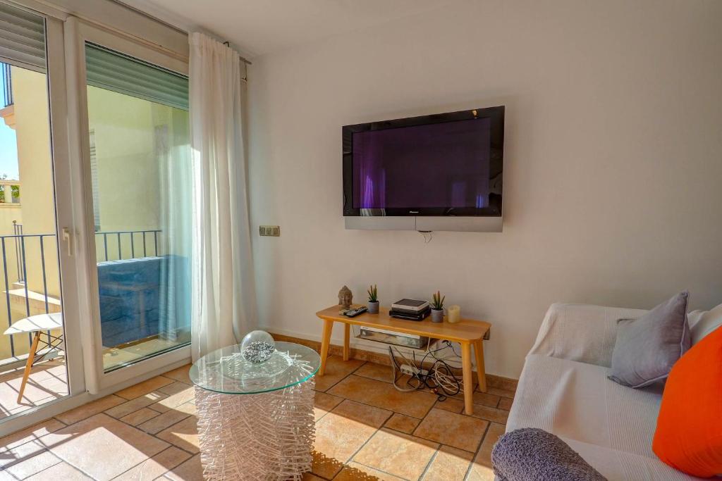 A television and/or entertainment centre at La Marina Sea Front by Hello Homes Sitges