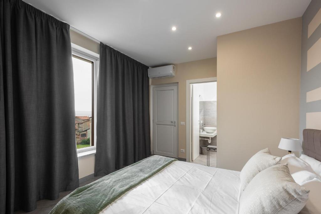 Postel nebo postele na pokoji v ubytování VIVERONE LAKE ROOMS