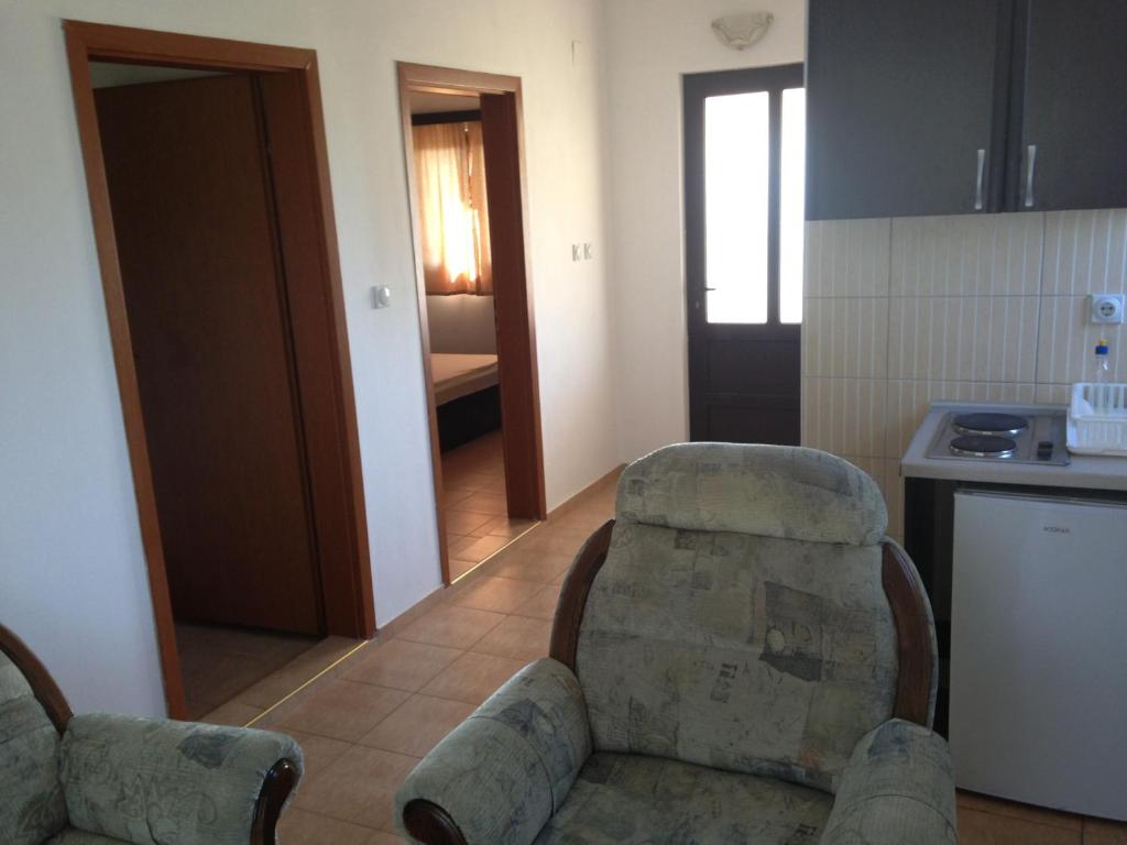 Kuchyň nebo kuchyňský kout v ubytování Niki Apartments