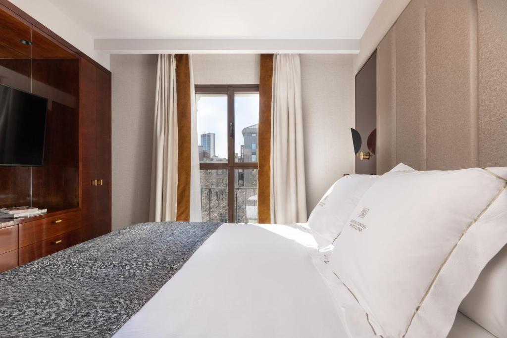 Postel nebo postele na pokoji v ubytování Suites Center Barcelona