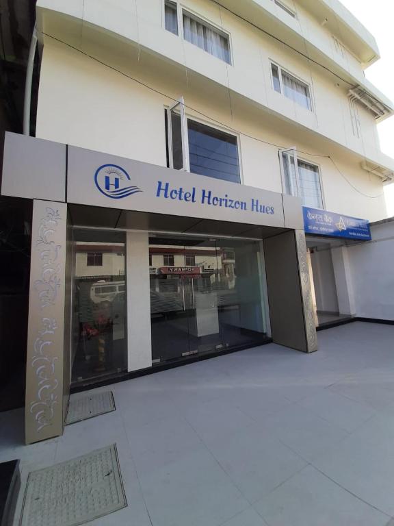 a hotel horizon lines sign in front of a building at Hotel Horizon Hues in Port Blair