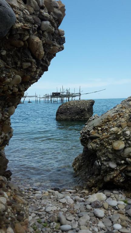 a view of the ocean with a pier in the water at Villa Marianna in Vasto