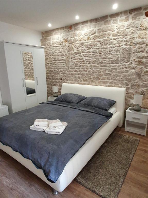 Postel nebo postele na pokoji v ubytování Sebenico Luxury Rooms