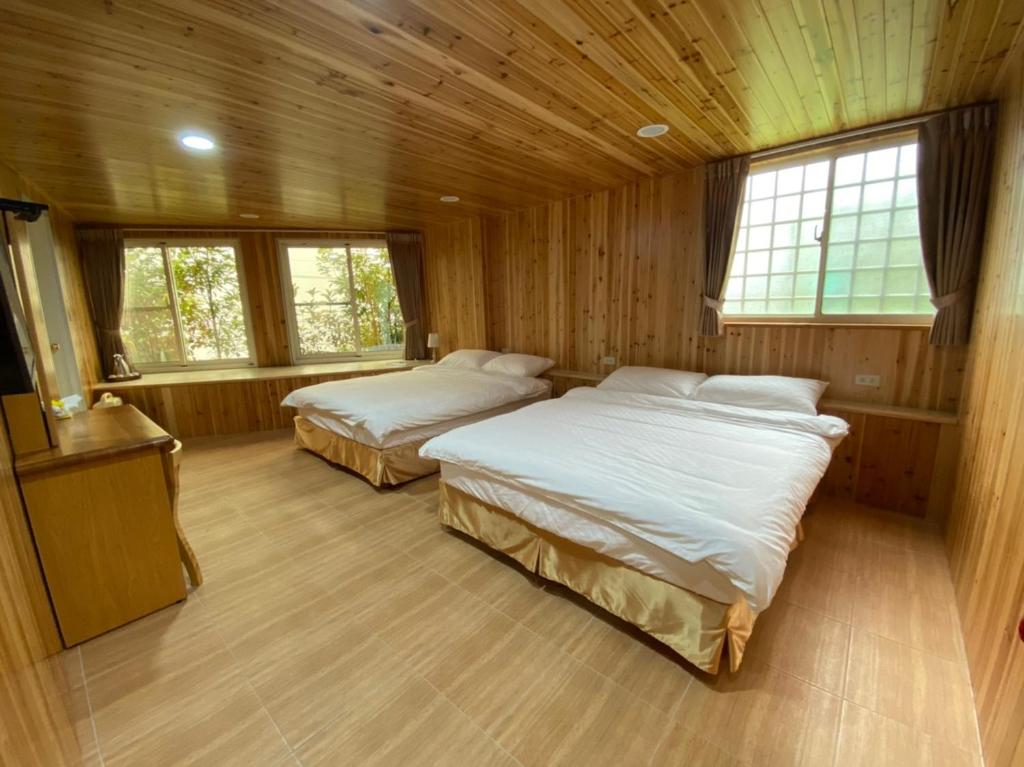 Postel nebo postele na pokoji v ubytování Green incense Homestay