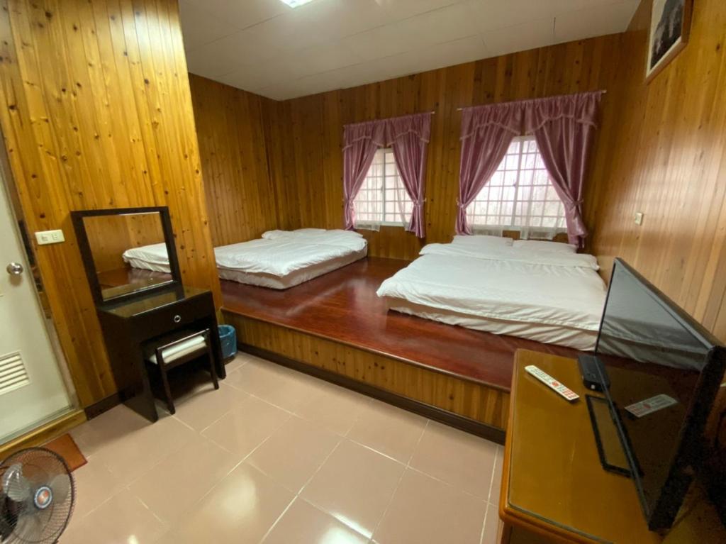 Postel nebo postele na pokoji v ubytování Green incense Homestay