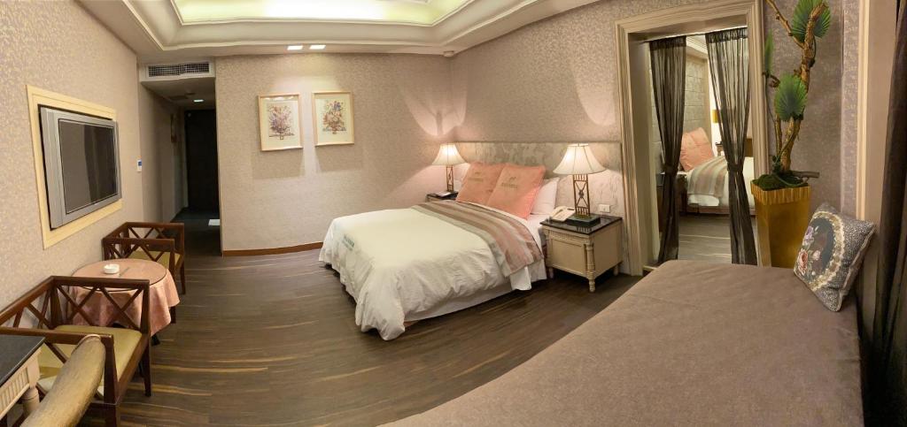 Postel nebo postele na pokoji v ubytování Zhi Baishan Motel