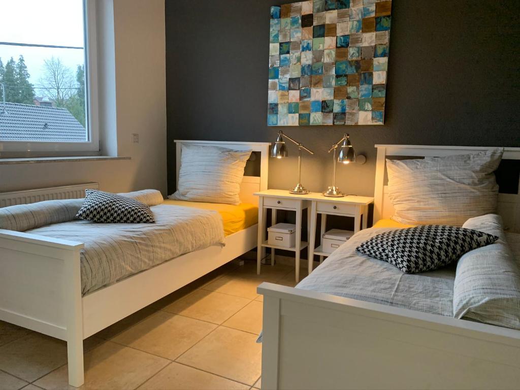 Postel nebo postele na pokoji v ubytování Luxus-Apartment Quierschied