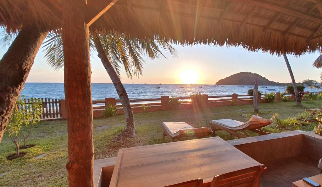 a view of the ocean from the patio of a resort at LE TRANSAT in Ambatoloaka