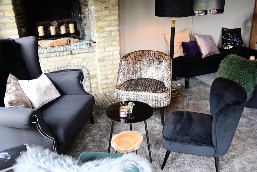 Posezení v ubytování Hotel Ten Lande