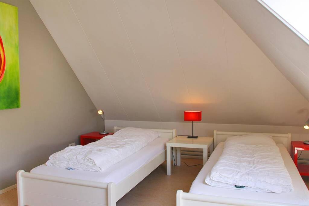 Postel nebo postele na pokoji v ubytování Appartement Abbestederweg Callantsoog