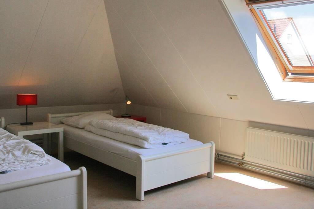Postel nebo postele na pokoji v ubytování Appartement Abbestederweg Callantsoog