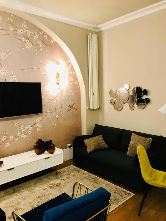 Televízia a/alebo spoločenská miestnosť v ubytovaní Porta Ticinese Apartment