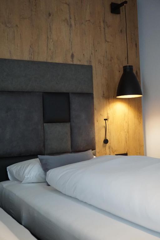 Postel nebo postele na pokoji v ubytování Hotel Grüner Baum