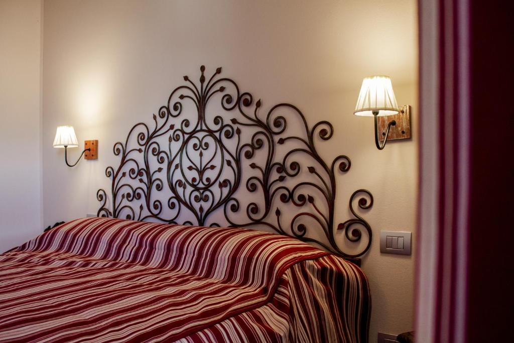 Posteľ alebo postele v izbe v ubytovaní Casa Tarò