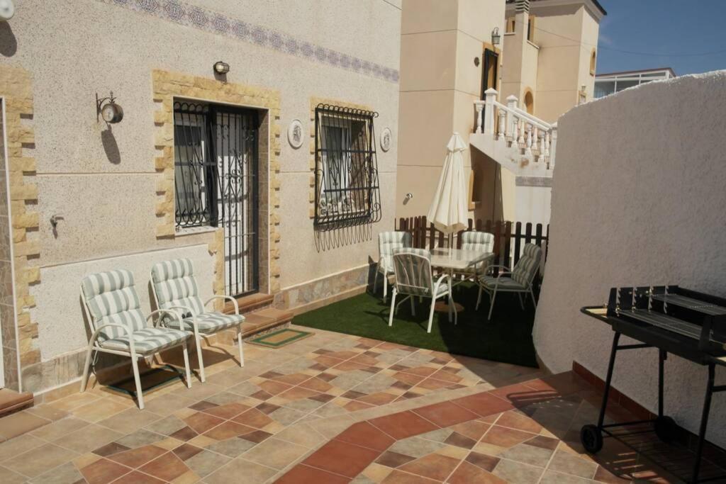 a patio with chairs and a piano on a building at Casa Antony in San Miguel de Salinas