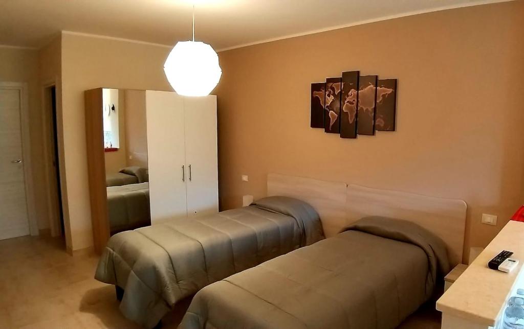 Postel nebo postele na pokoji v ubytování B&B GIRAMONDO