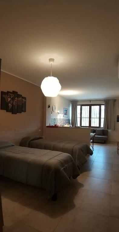 Postel nebo postele na pokoji v ubytování B&B GIRAMONDO