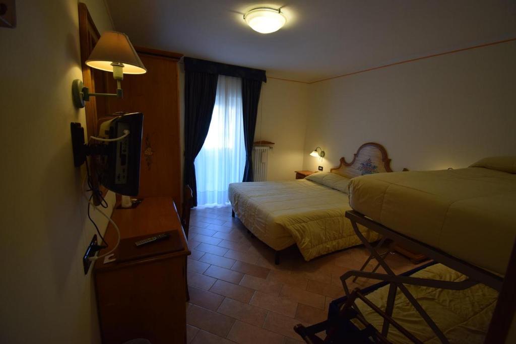 Postel nebo postele na pokoji v ubytování Park Hotel Mater Dei