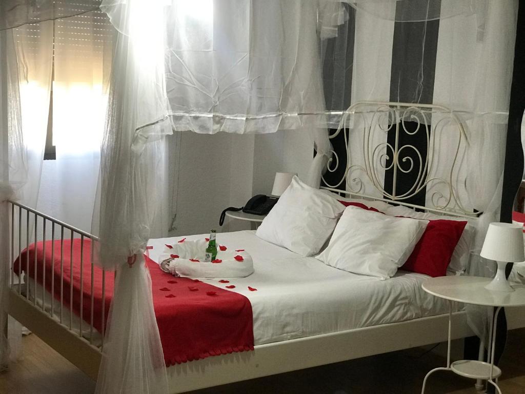 Postel nebo postele na pokoji v ubytování Hotel Argos