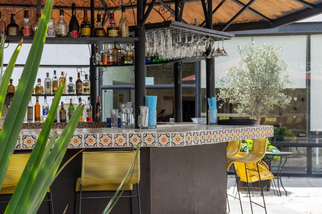 Nápoje v ubytování Hotel Hacienda San Cristóbal