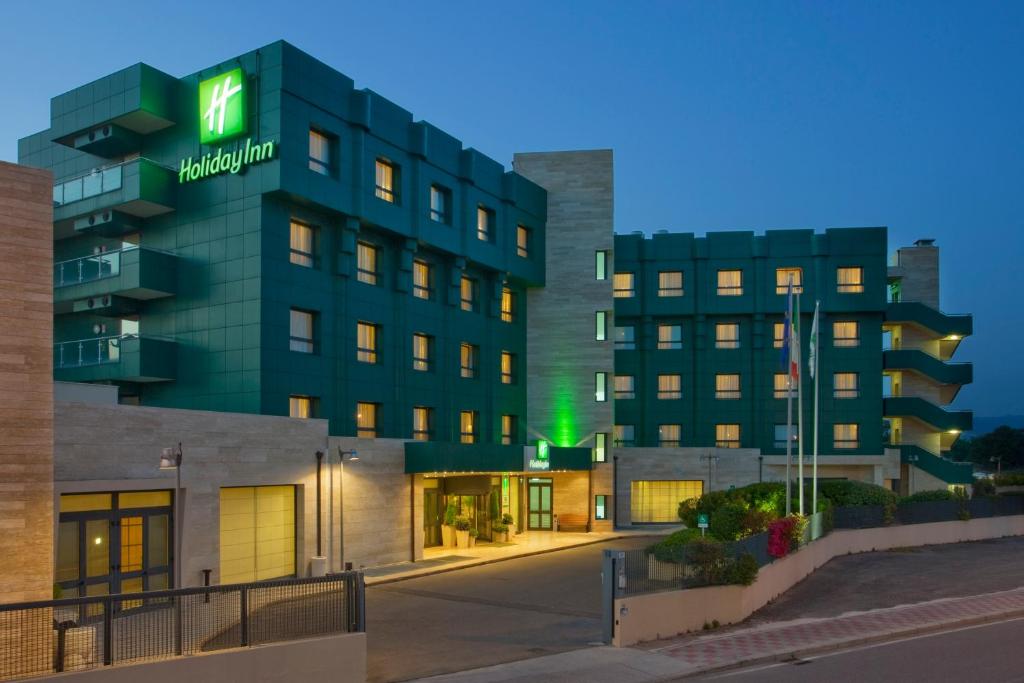 a rendering of the mgm hotel at night at Holiday Inn Cagliari, an IHG Hotel in Cagliari