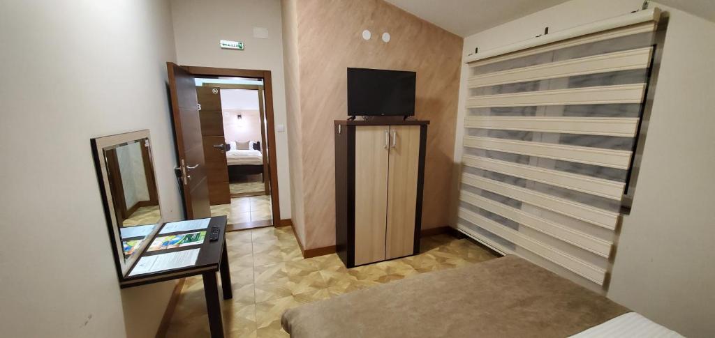 TV a/nebo společenská místnost v ubytování Cuki Residence