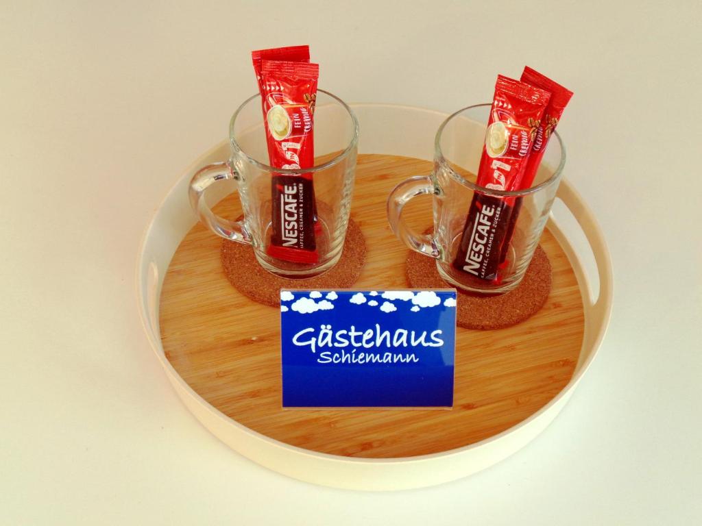 a tray with two glasses of christmas subindonesaturdaysaturdays at Gästehaus Schiemann in Teterow