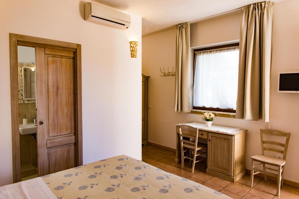 Postel nebo postele na pokoji v ubytování Villa Narducci