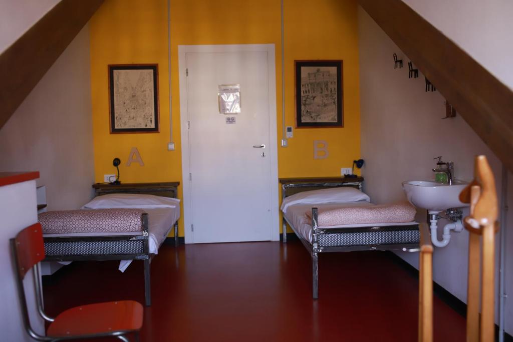 Posteľ alebo postele v izbe v ubytovaní Attic Hostel Torino