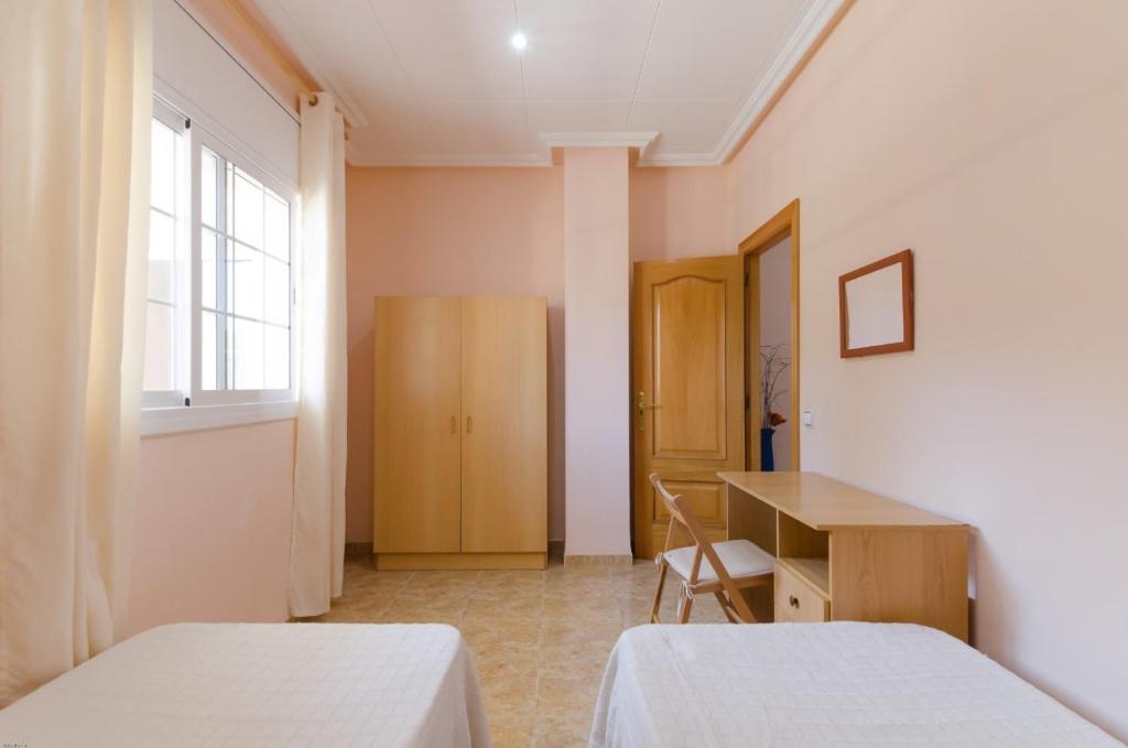 Postel nebo postele na pokoji v ubytování Club Villamar - Germana
