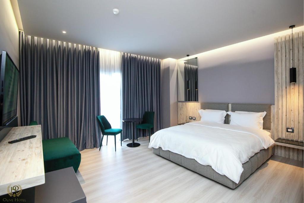 Postel nebo postele na pokoji v ubytování Hotel Olive