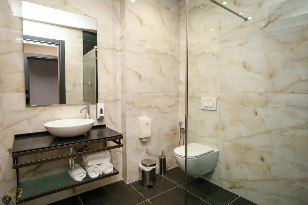 Koupelna v ubytování Hotel Olive