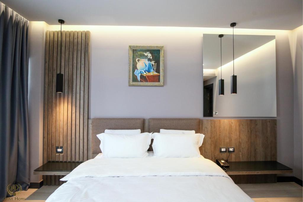 Postel nebo postele na pokoji v ubytování Hotel Olive