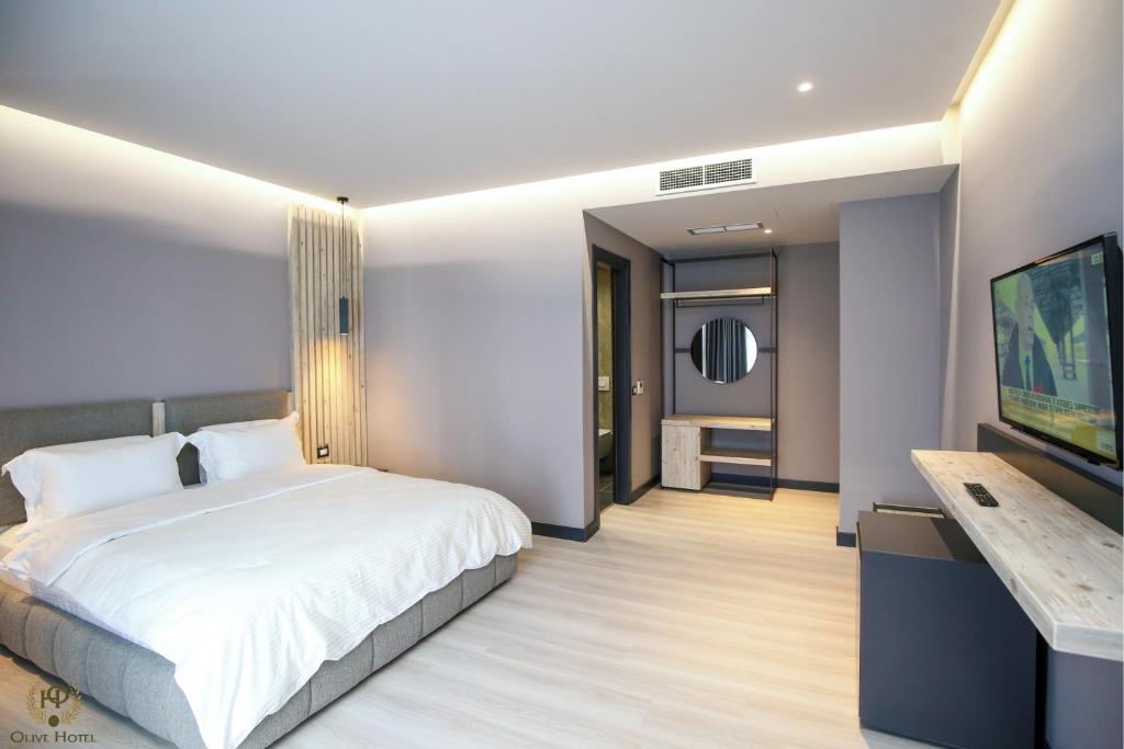 Postel nebo postele na pokoji v ubytování Hotel Olive