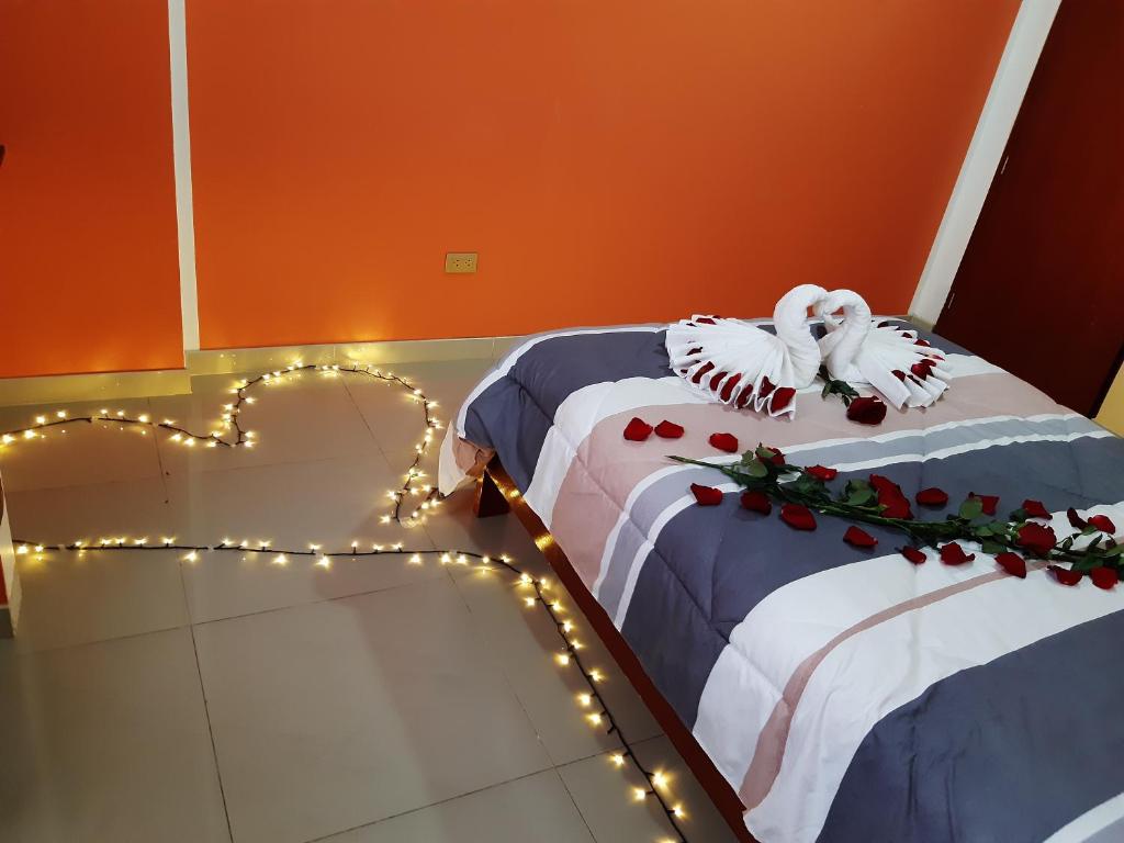 Postel nebo postele na pokoji v ubytování Hostal Capac