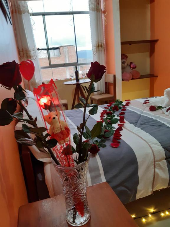 Postel nebo postele na pokoji v ubytování Hostal Capac