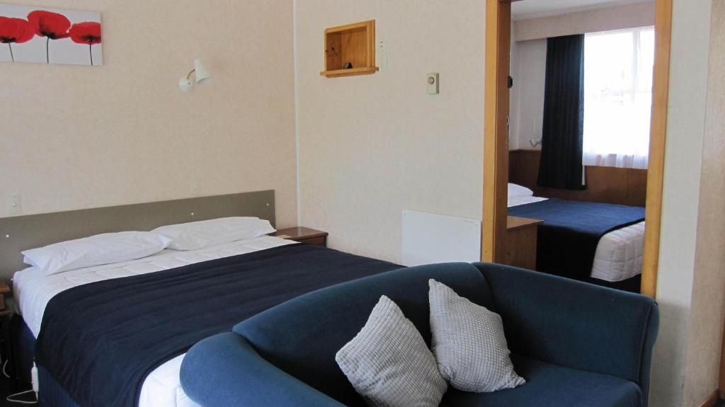 Postel nebo postele na pokoji v ubytování Cromwell Motel