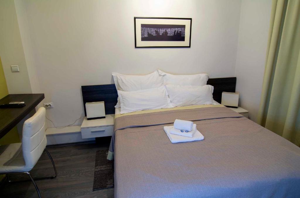 Postel nebo postele na pokoji v ubytování Garni hotel King