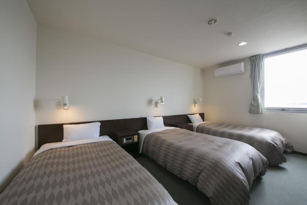 Postel nebo postele na pokoji v ubytování Okadaya Bayside / Vacation STAY 72737