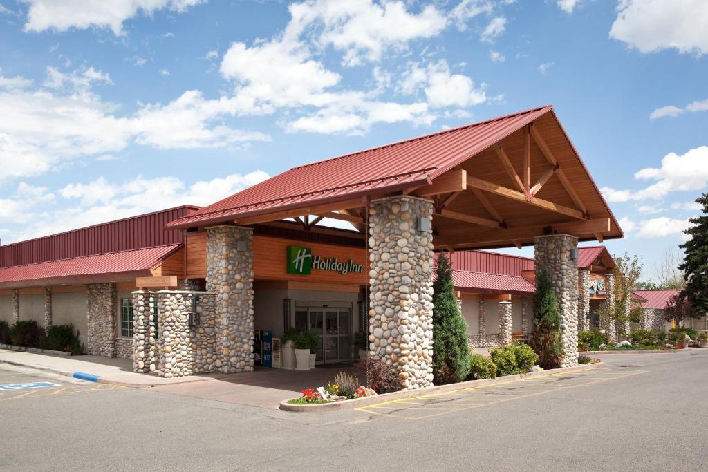 a grocery store with a building with a red roof at Holiday Inn Cody at Buffalo Bill Village, an IHG Hotel in Cody