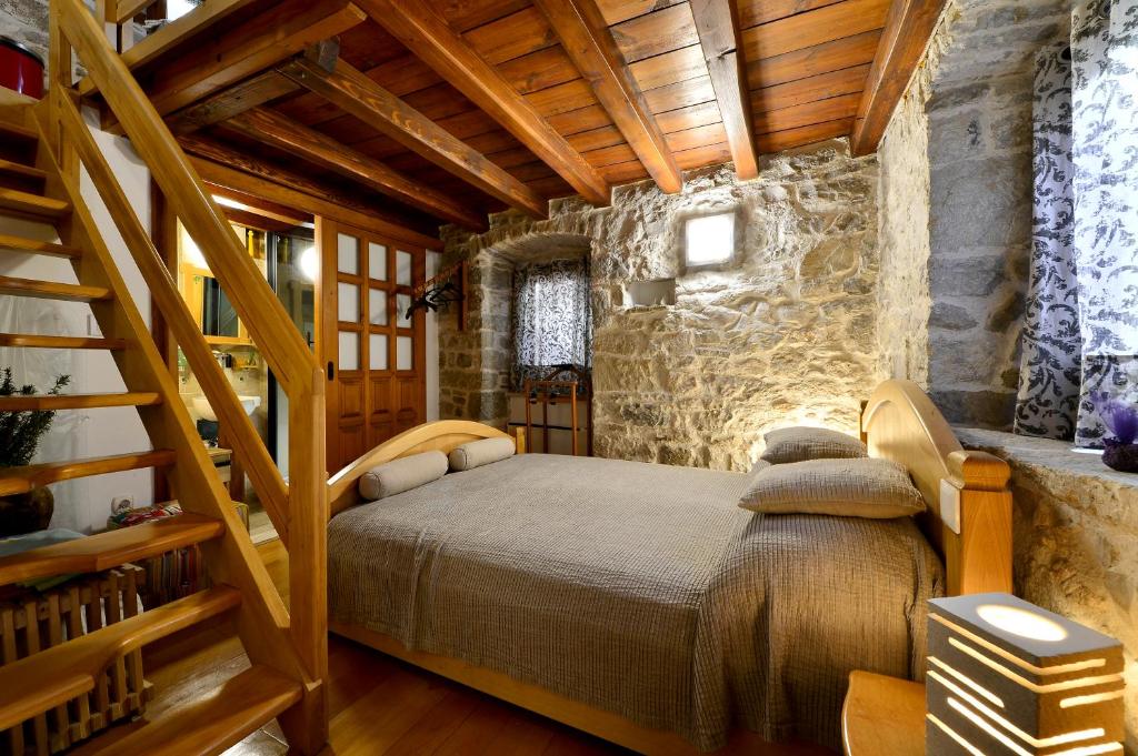 Postel nebo postele na pokoji v ubytování Apartments Salvezani