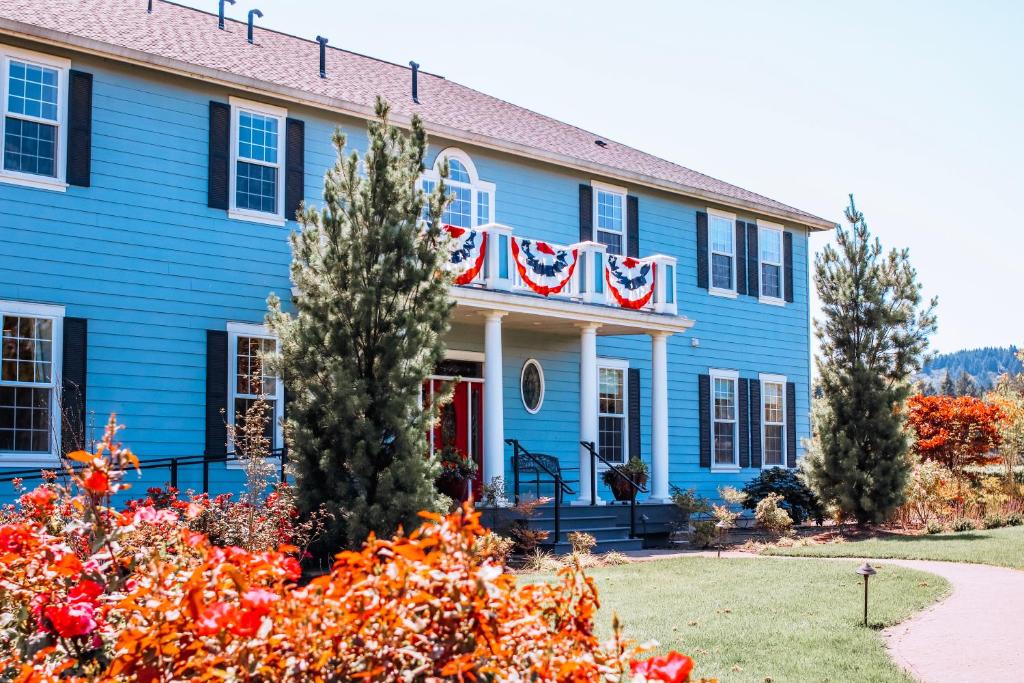 a blue house with an american flag on it at La Bastide Bed and Breakfast in Dundee